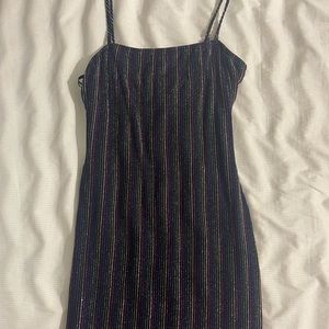 Black dress with multicolored sparkling lines.